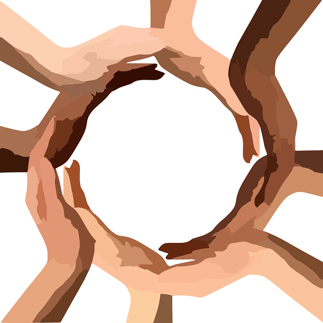 Eight hands with different skin tones form a circle